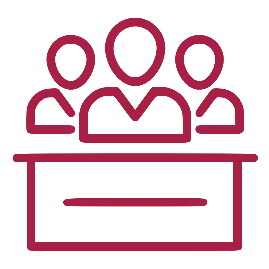 Das Icon zeigt drei Personen, die an einem Tisch sitzen.m